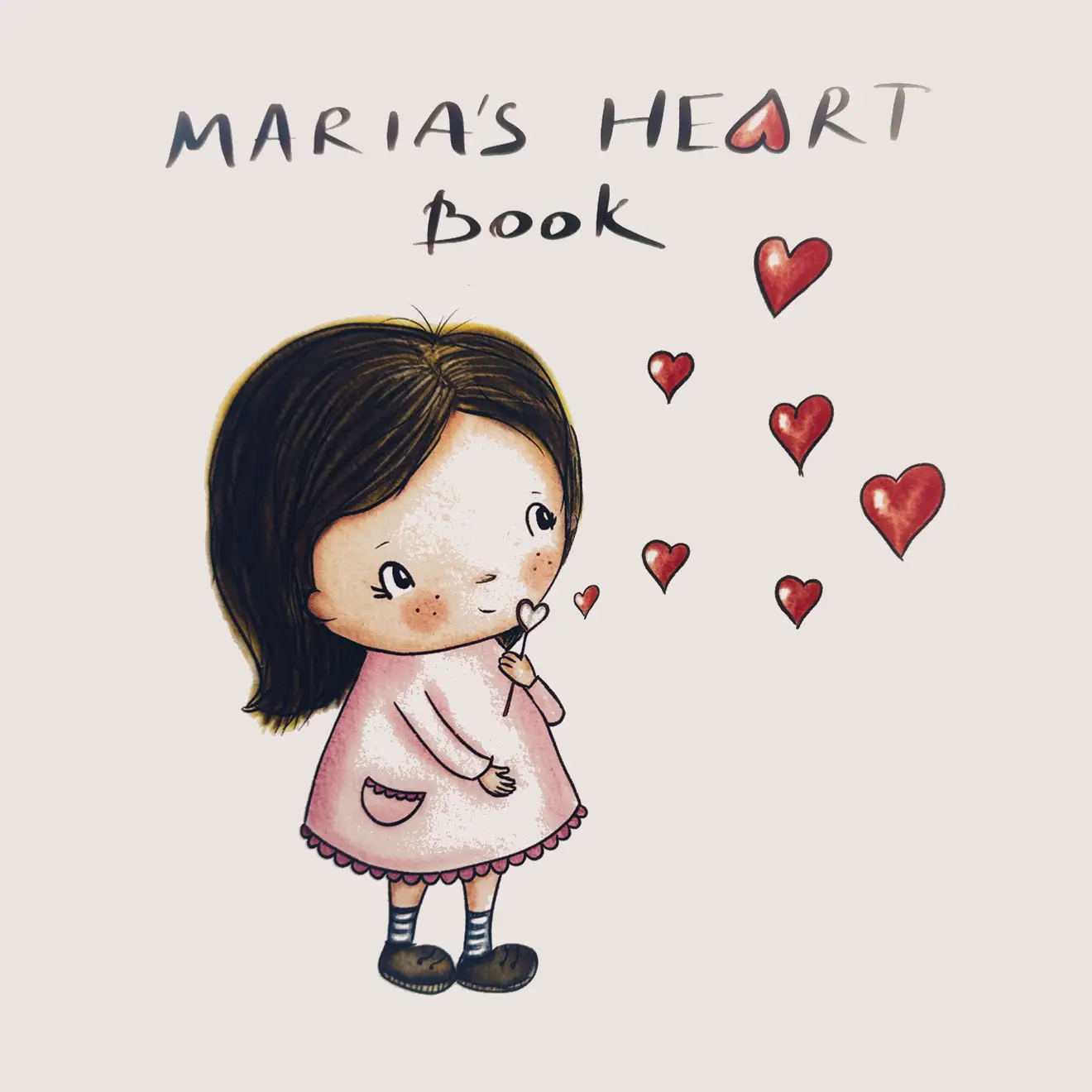 Front cover of an illustrated children's book called "Maria's Heart Book", showing a little girl surrounded by floating hearts.